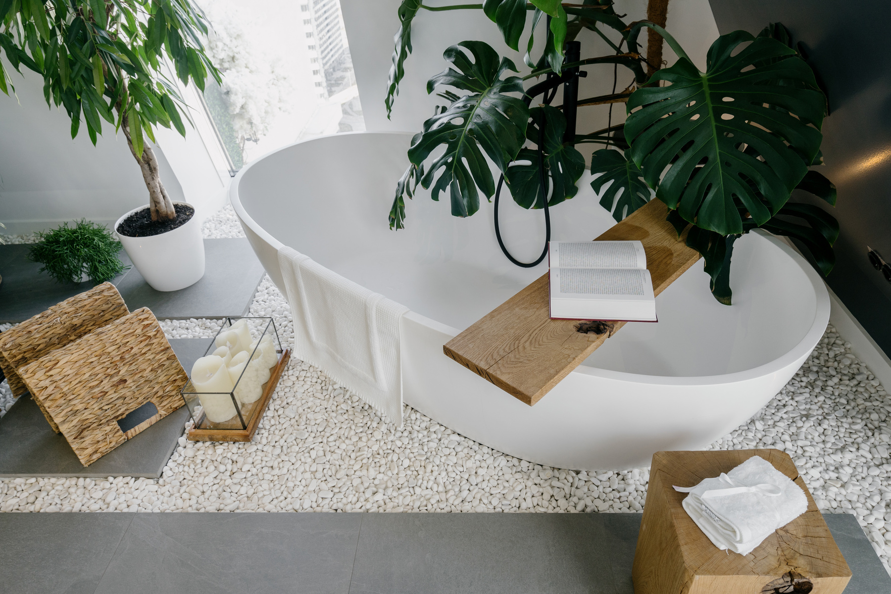 Bohemian bathroom interior decorated with green plants
